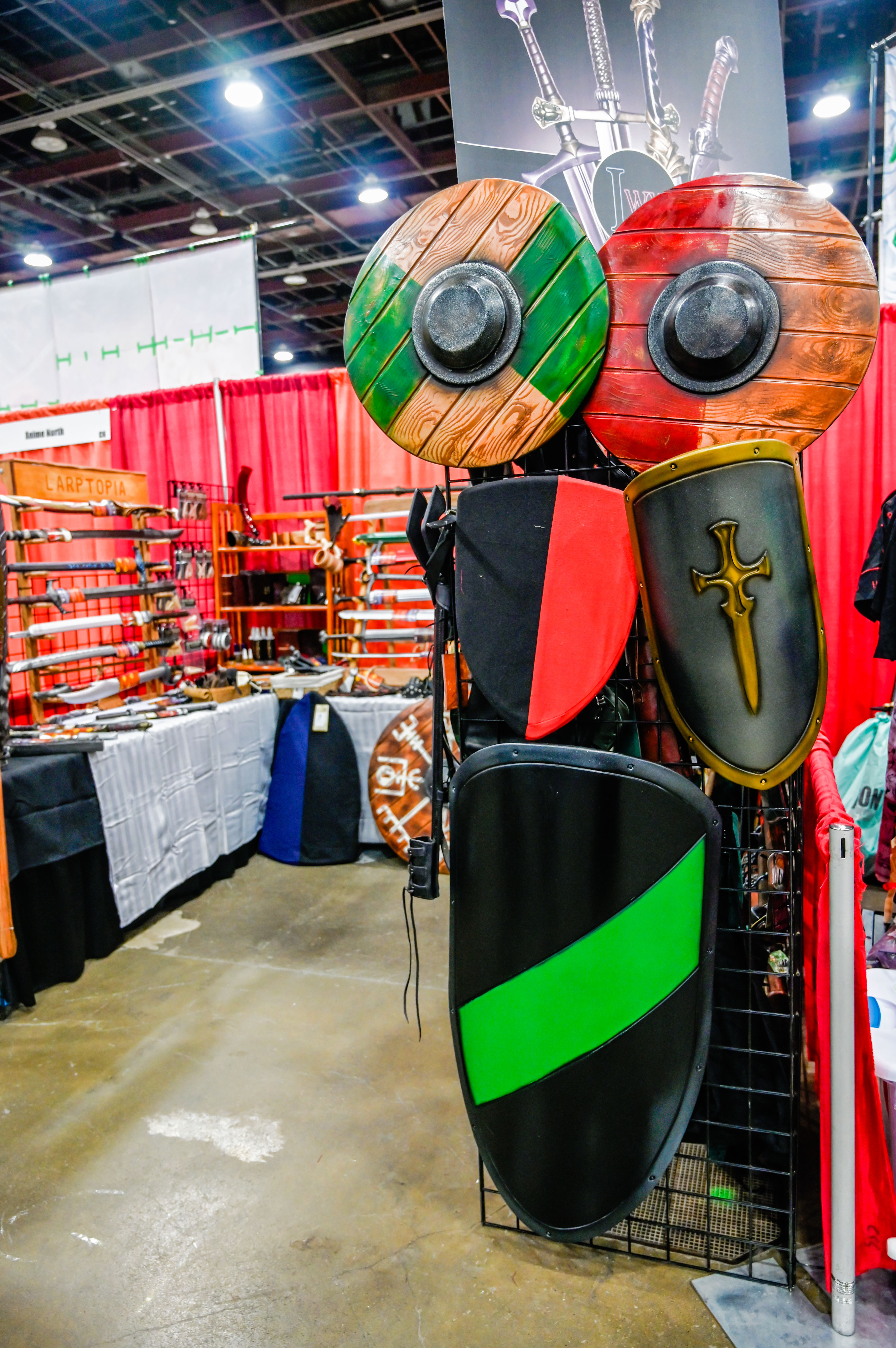 larptopia youmacon booth with foam shields, larp swords, and accessories