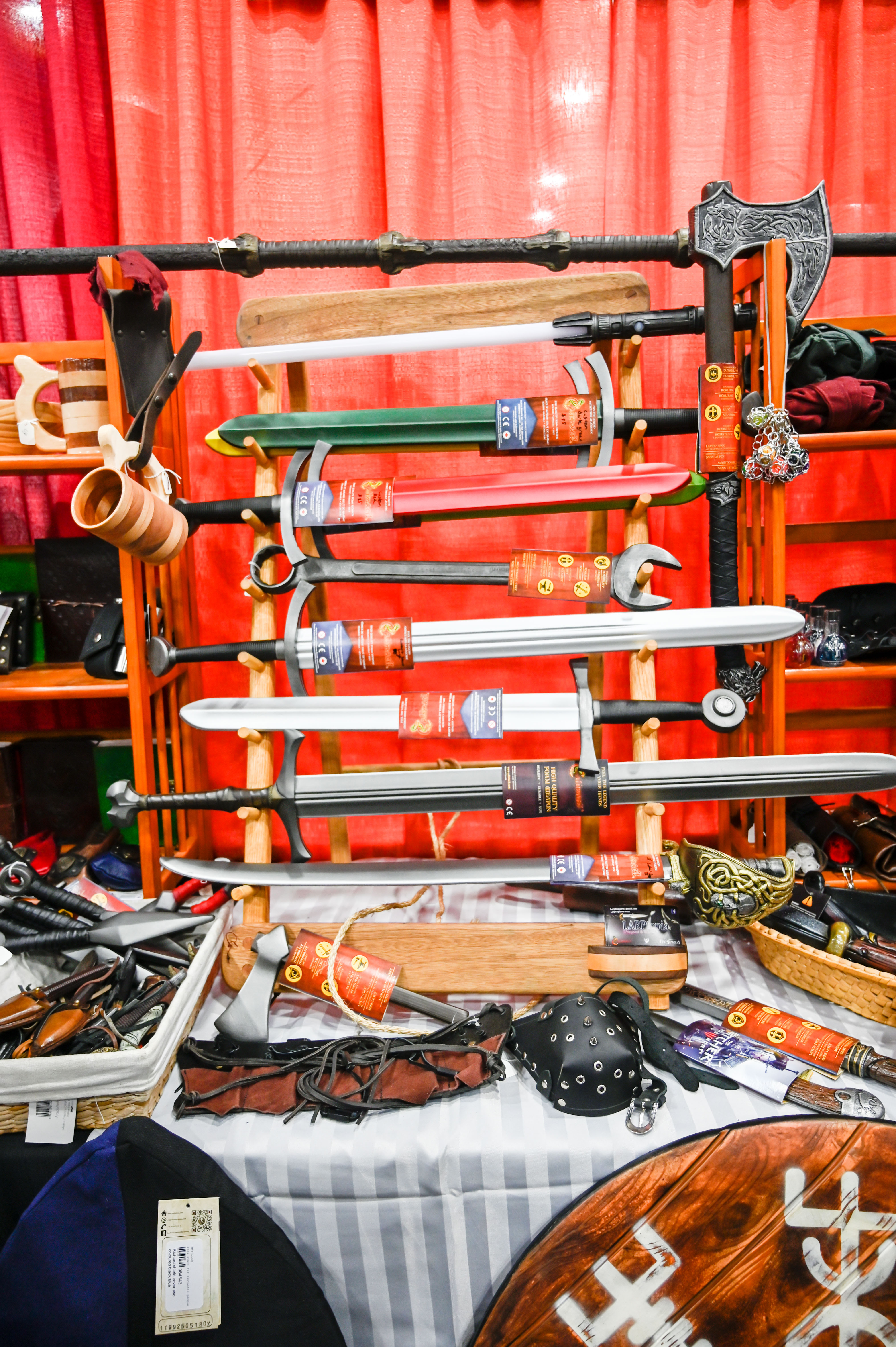 youmacon larptopia booth sword rack with larp swords calimacil