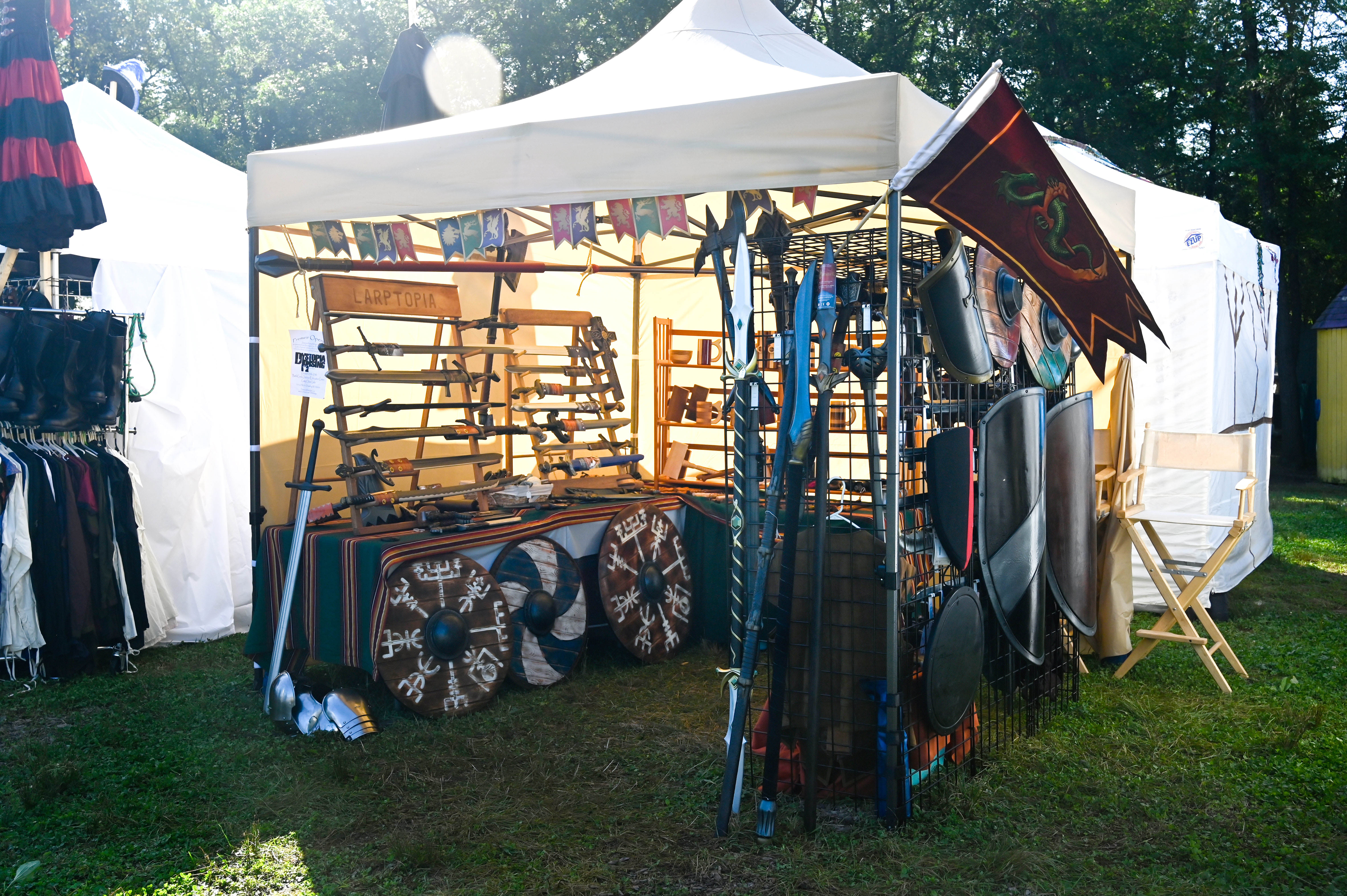 renaissance festival booth calimacil and epic armoury shields swords spears armor